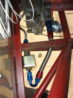 Fuel flows from Facet pump at bottom left through a 150 degree full flow hose end to the carb (top center) past a VDO fuel pressure sensor IMG_0418.jpg
